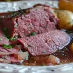 Amazing Angus Corned Beef: A Complete Guide to Recipes, History, and Nutrition 9 A crispy, golden-brown Angus corned beef hash served in a cast-iron skillet, topped with a perfectly cooked sunny-side-up egg and garnished with fresh parsley.